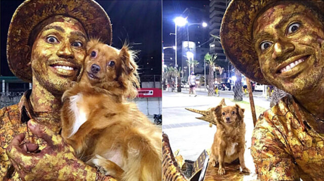 L’artista di strada si esibisce insieme al suo cane per ammaliare i passanti