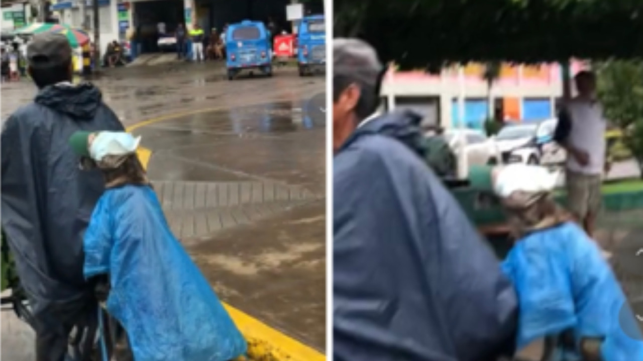 Uomo e cane in bici